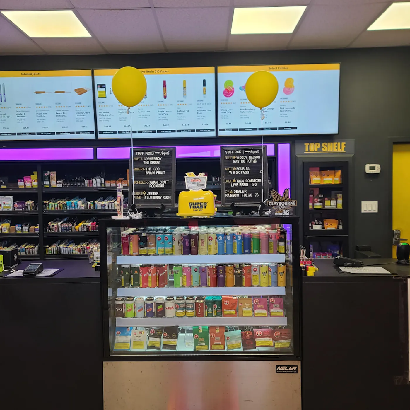 Take Off Cannabis product displays, staff picks, and brightly lit menu screens